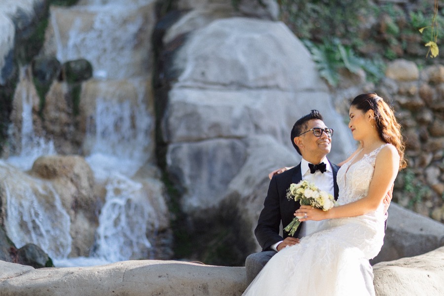 The couple beside a waterfall